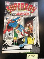 Front cover of 1967 DC Comics Superboy #137 comic book featuring Superboy and a child on a doorstep with two elderly people.