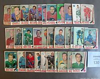 Lot of 32 lower grade 1969-70 O.P.C. hockey cards spread out, showing various players from multiple NHL teams.