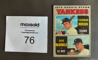 Two 1970 OPC rookie baseball cards for Thurman Munson and Dave McDonald next to lot number 76 card.