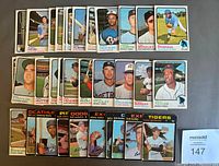 Top view showing 35 OPC baseball cards arranged in several rows, featuring various players from the 1971 and 1973 years.