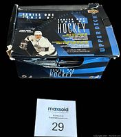 Partial box of 1993-94 Upper Deck Hockey Series 1 showing front and top with player image and box details.