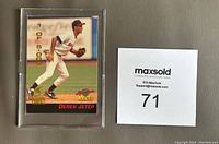 Front of the 1994 Derek Jeter Signature Rookies card in protective casing showing player mid-action with numbering 1 of 5,000 and card details.