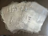 Lot of multiple clear plastic Ultra Pro 9-card pages stacked together, showing the overall quantity and condition.