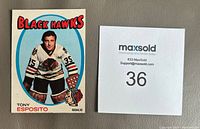 Front of the Tony Esposito hockey card showing sharp corners and original gloss with the player image and team name.