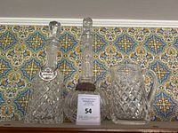 All three crystal pieces displayed against patterned background