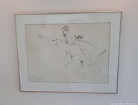 Full front view of framed artwork hanging on white wall