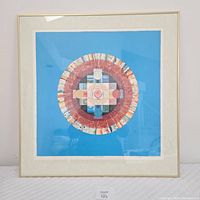 Full view of framed lithograph on white background