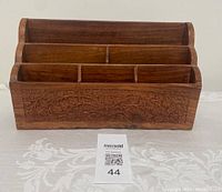 Front view showing 6 slots and floral carved details