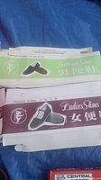 Labels of the Kung Fu shoes indicating 'Gentleman Shoe' and 'Ladies Shoes' from Tianjin China