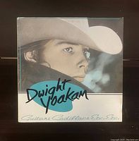 Front cover of Dwight Yoakam - Guitars Cadillacs Etc. Etc. vinyl record album showing a portrait of Dwight Yoakam in a cowboy hat.