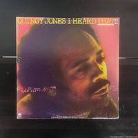 Front cover of Quincy Jones 'I Heard That!' vinyl record showing close-up photo of Quincy Jones head in profile and title text.