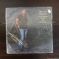Front album cover of Willie Nelson 'Somewhere Over The Rainbow' vinyl record, showing artist standing and album title.