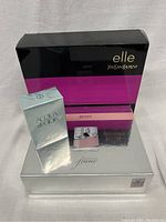 Three fragrance gift sets boxed from Yves Saint Laurent, Hugo Boss, and Giorgio Armani.