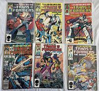 Overview of six comic book covers laid out on white background: original series issues #1-4 and movie tie-in issues.