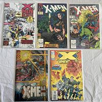 Group photo of five Marvel Comics X-Men comic books laid out on a white surface.