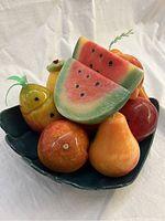 Photo showing ceramic stone fruit variety and plate