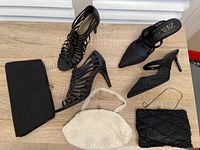 Overview of all items including purses and shoes on wooden floor, showing the condition and styles