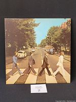 Front album cover showing The Beatles crossing Abbey Road zebra crossing