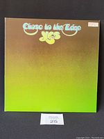 Front cover of vinyl record "Close to the Edge" by Yes with gradient green and brown design