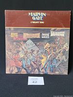 Front side of Marvin Gaye 'I Want You' album cover showing detailed illustration and light writing marks.