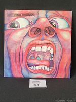 Front cover of King Crimson vinyl with iconic screaming face artwork, illustrating the 12-inch album cover in good condition.