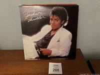 Michael Jackson Thriller album cover front showing Michael Jackson in white suit.