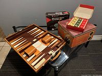 Backgammon board with dice, doubling cube, and leather-like playing surface in brown and tan