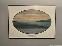 Full view of framed print showing oval artwork and signature beneath.