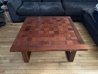 Full front view of square chessboard top and U-shaped base legs