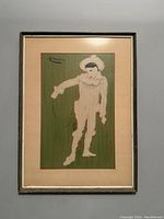 Framed lithograph showing white clown figure on green background, with beige mat and silver frame.