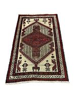 Full view of small Persian rug showing central diamond medallion pattern and border designs.