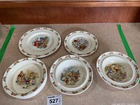 Top view showing total 5 Bunnykins dishes with colorful bunny character illustrations and bunny border