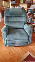 Front view of green La-Z-Boy recliner chair showing padded back and armrests
