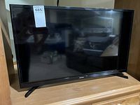 Front view of the 32 inch Samsung LCD TV showing the screen and stand legs