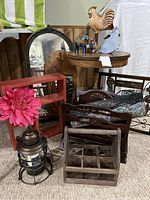 Full view of lot showing various vintage wood decor items and antique table