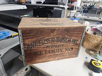Side view showing Anheuser-Busch Inc. Property printed on crate.