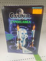 Front of box showing Casper Candelabra, mentioning flickering light-up candle flames and light-up eyes.
