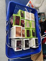 Blue crate filled with multiple boxes of Naturtint hair dye in different shades.