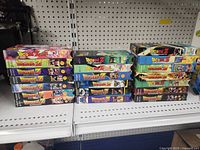 Three stacks of Dragonball Z VHS tapes with colorful illustrated covers, 20 tapes in total