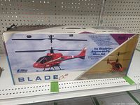 Photo of the front of the box showing the red E-flite Blade CX2 micro RC helicopter ready to fly.
