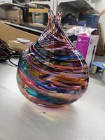 Overall view of the vase showing teardrop form and multicolor swirl pattern