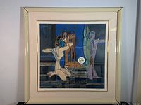 Full framed lithograph showing abstract figures with dominant blue background and Plexiglas frame.