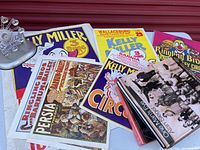 Group view: Ferris wheel model, books, posters arranged on table