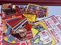 Top view of various circus posters, books, and circus truck toy showing titles and colorful artwork