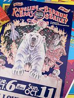 Photo showing colorful Ringling Bros and Barnum & Bailey Circus poster featuring a polar bear, clown, tiger, and circus acts branding