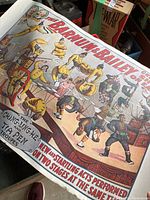 Close-up of a Barnum and Bailey circus poster showing acrobats and performing acts in vibrant colors.