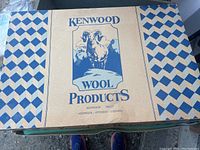 Closed box labeled Kenwood Wool Products with ram logo, indication of Canadian origin in Arnprior, Ontario.
