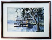 Full view of the framed and matted original watercolour painting by Todd Reifers depicting a lake scene with a dock, boat, and fishing supply shop under a large tree.