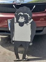 Front view of the Banksy-inspired Space Monkey painting showing black and white paint on wooden board with dripping paint effect and ape figure design.