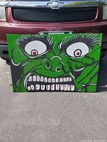 Full front view of the acrylic painting displaying the Hulk's angry face with green background and bold detailing.